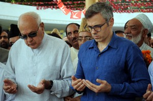 NC president Dr Farooq Abdullah along with Omar Abdullah offering Fateha (prayers) for Sheikh Mohammad Abdullah on his 33rd death anniversary at his grave in Hazratbal, Srinagar on Tuesday. —Excelsior/Amin War