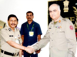 BSF Director General D K Pathak greets DG Pakistan Rangers (Punjab) Maj Gen Umar Farooq Burki during their biannual meeting in New Delhi on Thursday. (UNI)