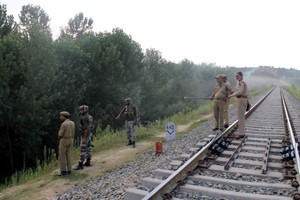 Cops maintain surveillance on railway track at Malangpora after grenade attack. -Excelsior/Younis Khaliq