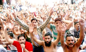 PHE workers holding protest demonstration at Chief Engineer's office on BC Road in Jammu on  Thursday.  -Excelsior/Rakesh