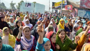 People holding protest demonstration in Srinagar on Monday. —Excelsior/Amin War