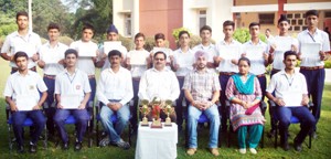 Footballers of MHAC School Nagbani posing for a group photograph alongwith the dignitaries in Jammu on Monday. 