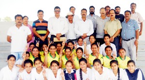 Girls posing for a group photograph after lifting the Inter-School Under-19 cricket title at Arazi Stadium in Samba.