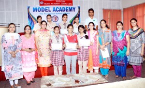 Winners of Debate Competition posing for a group photograph at Model Academy in Jammu. 
