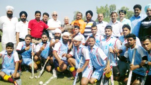 Winners of Inter-Collegiate Hockey Tournament posing for a group photograph alongwith dignitaries in Jammu.