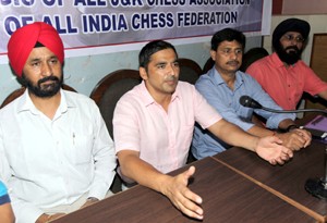 Atul Kumar Gupta president “All J&K Chess Association” and other office bearers addressing media persons in Jammu on Monday.-Excelsior/Rakesh