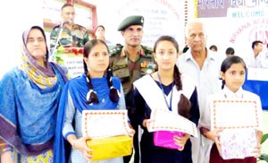 Winners posing alongwith dignitaries during concluding function of painting, essay and quiz competition organized jointly by Army and Nirvana Academy in Ramban on Tuesday.