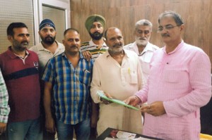 Taxi operators submitting a memorandum to Speaker Kavinder Gupta at Jammu on Monday.