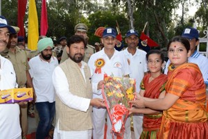 Minister for Health & Medical Education, Choudhary Lal Singh being presented bouquet while inaugurating 39th BSF Inter Frontier Hockey Championship.