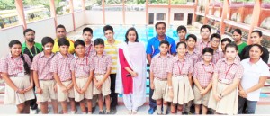 Swimmers of Jodhamal Public School posing for a group photograph alongwith School Management on Saturday.