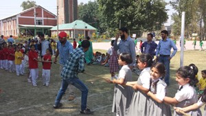 Players in action in Tug-of-War competition during 3rd Highland Kids Sports Meet in Srinagar on Tuesday.