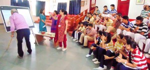 Participants of Art Awareness Programme watching resource person at Jodhamal Public School in Jammu on Friday.