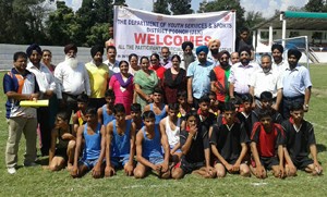 Players posing for a group photograph during inaugural ceremony of Rajiv Gandhi Khel Abhiyan Tournament at Sports Stadium in Poonch.