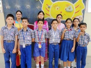 Medal winners of Sprawling Buds School posing for a group photograph. 