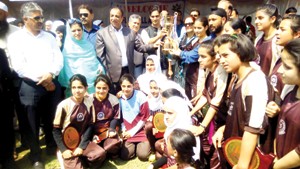 Jubilant Mallinson girls team posing for a group photograph alongwith the dignitaries in Srinagar on Thursday.