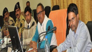 DyCM Dr Nirmal Singh reviewing the pace of developmental works in a meeting at Ramban on Monday.