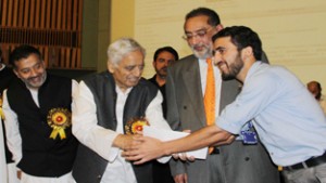 Chief Minister, Mufti Mohd Sayeed handing over placement order to a youth at Srinagar on Wednesday.