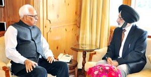 Governor, N N Vohra interacting with Director Sainik Welfare, Brig Harcharan Singh at Raj Bhavan on Wednesday.