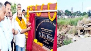 Minister for Forests, Bali Bhagat during launching of Janipur-Amb Ghrota road on Sunday.