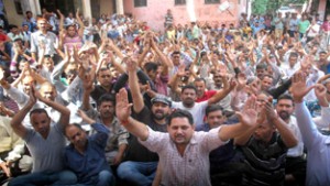 PHE workers staging protest demonstration outside Chief Engineer's office on BC Road in Jammu on Thursday.  —Excelsior/ Rakesh 