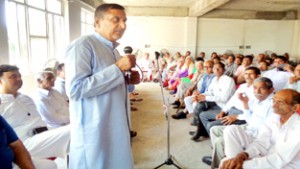 Former Minister Sham Lal Sharma addressing monthly meeting of Congress at Akhnoor on Tuesday. 