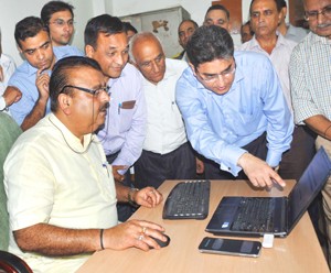 Minister for Industries, Chander Prakash Ganga launching online registration facility at DIC on Monday. 