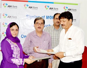 J&K Bank and M/s Omkar Nest Private Limited during signing of MoU at Srinagar.