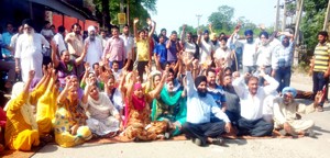 Residents raising slogans during protest.