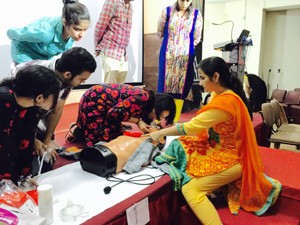 A doctor demonstrating various techniques of resucitation of a victim of cardiac arrest to medical students during a workshop at ASCOMS in Jammu.