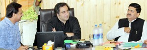 Minister for Animal Husbandry, Sajjad Gani Lone chairing a meeting at Srinagar on Tuesday.