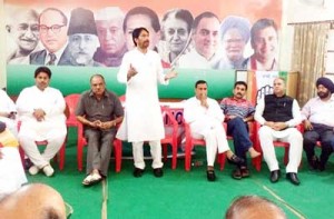 PCC chief GA Mir addressing Cong leaders and workers meeting in Jammu on Friday.