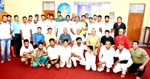 KP cricketers posing for a group photograph alongwith dignitaries during a function organized by AIKS at Sanjeevani Sharda Kendra, Anand Nagar, Bohri in Jammu on Friday.