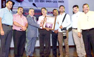 Speaker, Legislative Assembly, Kavinder Gupta and others presenting 'Pahal Yuva Gourav Samman' to Photojournalist of Daily Excelsior Rakesh Bakshi at Police Auditorium, Gulshan Ground, Jammu on Thursday.