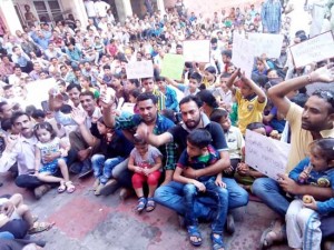 PHE workers staging protest demonstration along with families at  Chief Engineer's Office on BC Road in Jammu on Sunday.