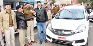 DGP K Rajendra handing over bumper prize to raffle draw winner.