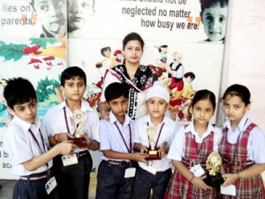 Winners of debate competition posing for a group photograph at JK Montessorie Sr. Sec. School in Jammu.