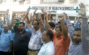 Government pharmacists during a protest in the premises of office complex of DHS Jammu on Saturday. -Excelsior/Rakesh