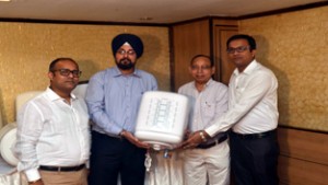 Officials of Crompton Greaves and retailers during the launch of new range of storage water heaters at Jammu.