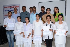 Winners of one day inter-college seminar posing for group photograph on Tuesday.