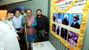 Deputy Chief Minister, Dr Nirmal Singh and others paying homage to martyrs of 1947 during a function at Jammu.