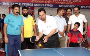 Chief guest, VK Magoo displaying TT skills while inaugurating Jammu District Table Tennis Championship in Jammu on Friday.       -Excelsior/ Rakesh
