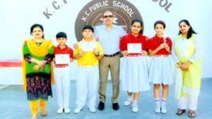 Students of KC Public School who won second spot in French Translation Contest posing for a group photograph alongwith School Principal.