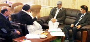 Minister for Law, Syed Basharat Bukhari chairing a meeting at Srinagar on Wednesday.