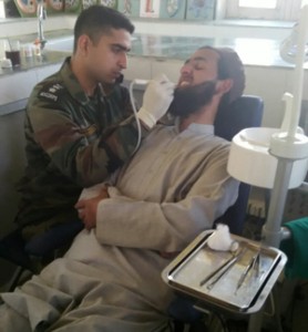 An Army doctor treating a local during a medical camp at village Uthura in Baramulla. 