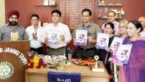 CVC, J&K Kuldeep Khoda, alongwith other dignitaries releasing Rotary Club news letter during a function at Jammu.  —Excelsior/Rakesh