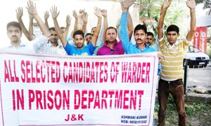 Candidates of Jail Wardan during a protest at Jammu on Friday.