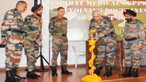 DG Medical Services (Army) Lt Gen M K Unni lighting ceremonial lamp to inaugurate a seminar in presence of GOC-in-C Lt Gen D S Hooda and others at Udhampur on Friday.