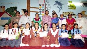 Winners of Bottle Crafting Competition posing for group photograph.