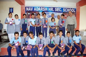 Winners of quiz competition posing for a group photograph at Nav Adarsh School in Kathua on Thursday.