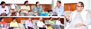 Deputy Chief Minister Dr Nirmal Singh chairing a meeting at Jammu on Thursday.